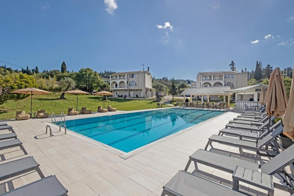 Main swimming pool at Pelithea Resort with crystal clear water